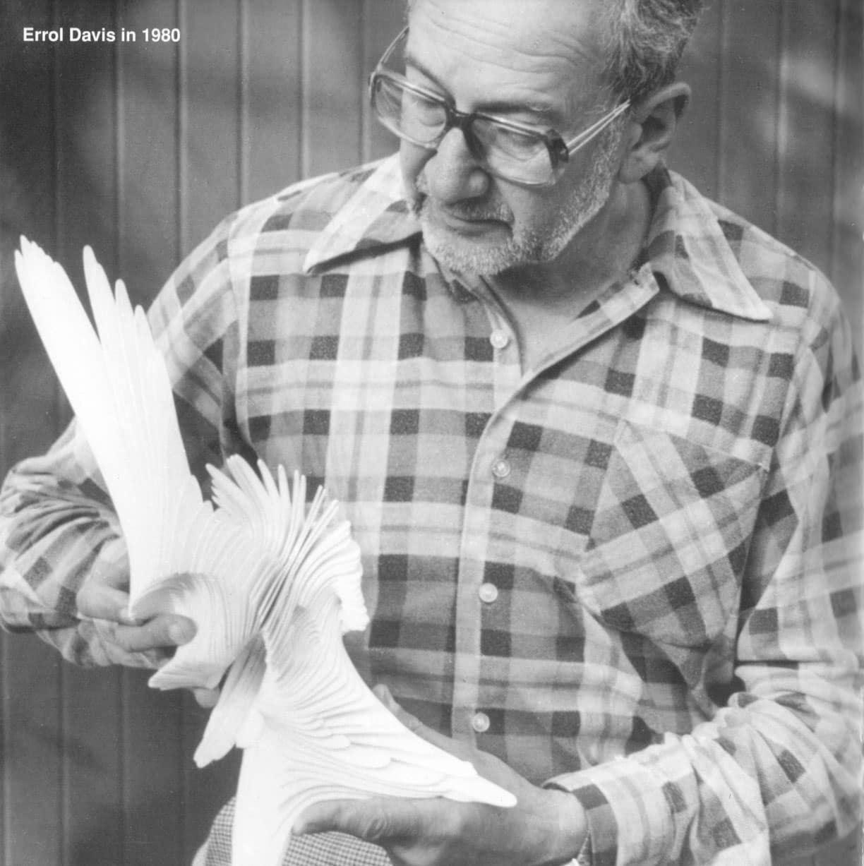 Errol Davis in 1980 holding a small stainless steel sculpture