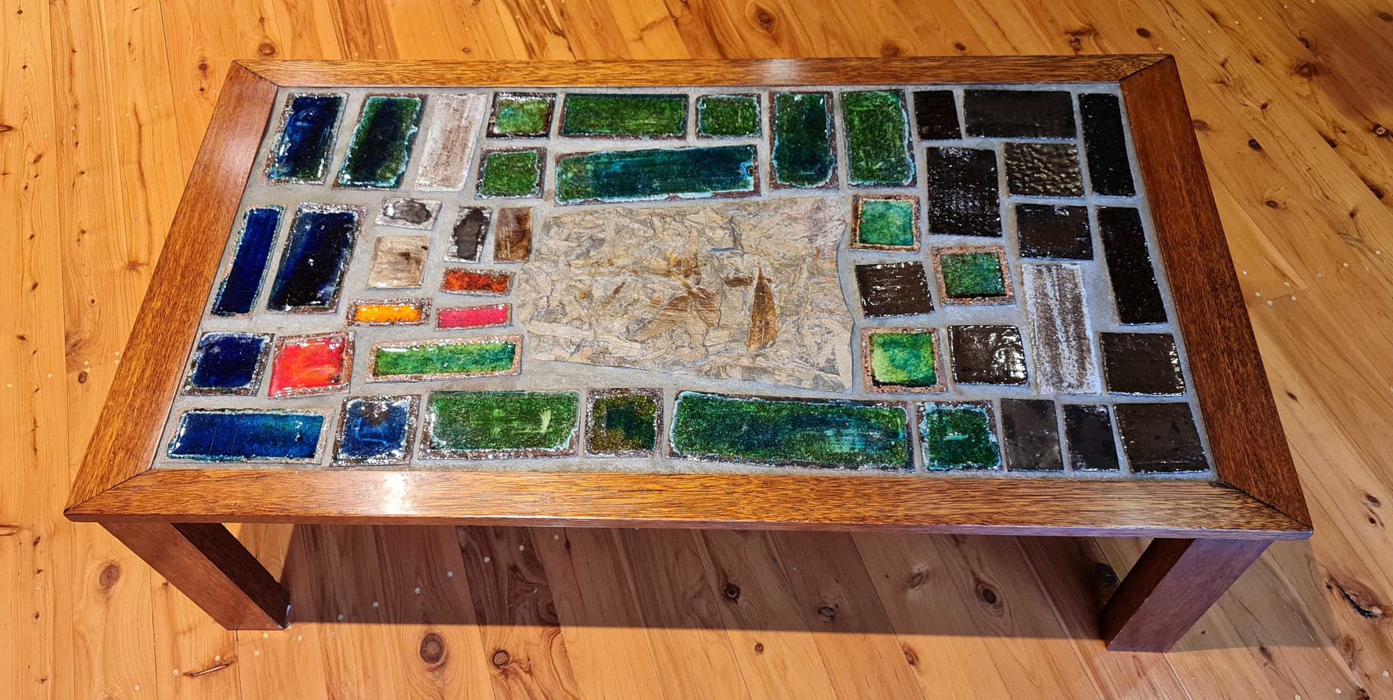 Coffee Table, 1975, wood frame, ceramic/glass tiles, fossil centrepiece