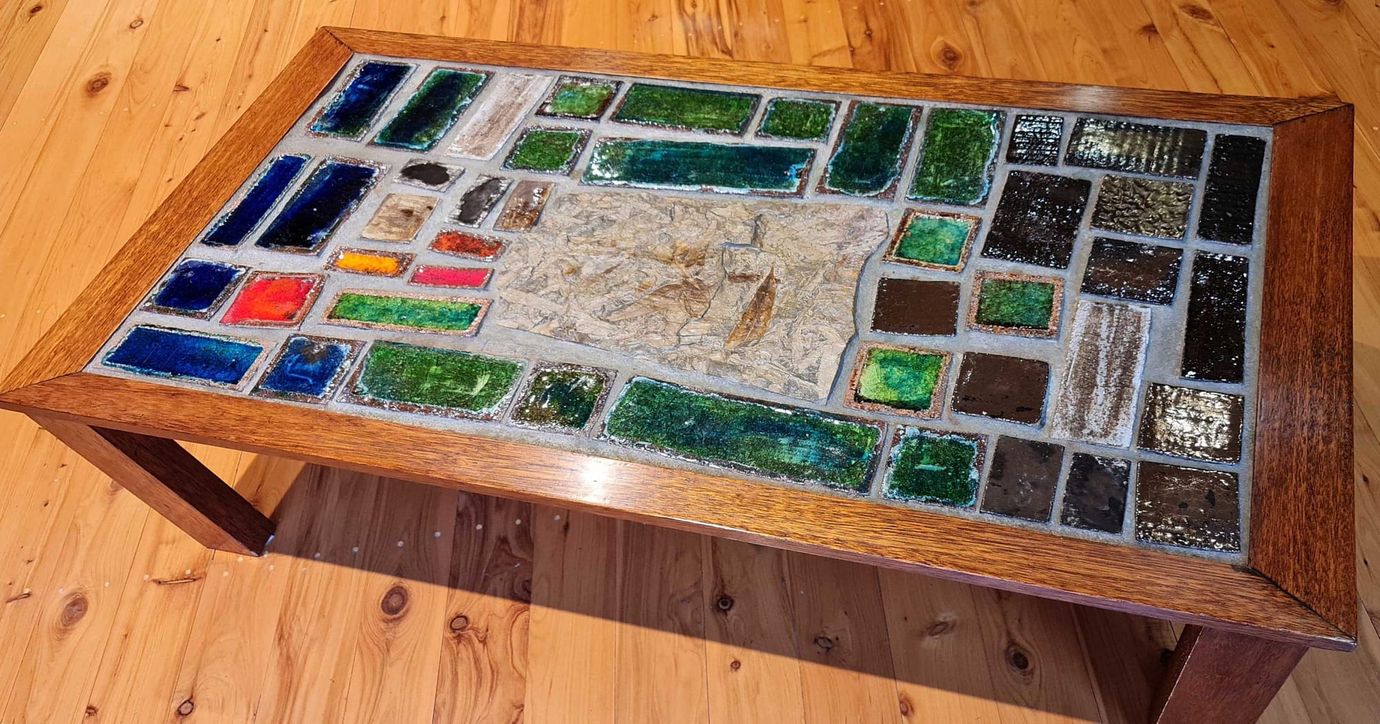 Coffee Table, 1975, wood frame, ceramic/glass tiles, fossil centrepiece